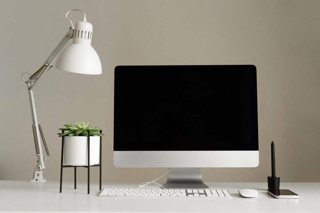 Designer workspace. Minimalistic home office. Blank screen desktop computer, Mockup desktop computer